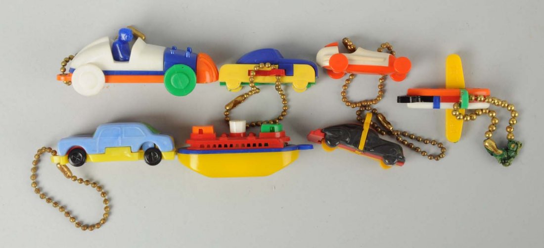 Lot Of 7: Keychain Puzzles.: Lot includes two race cars, a ship and four others. Condition (Excellent). Size Largest: 2 - 1/2" L.