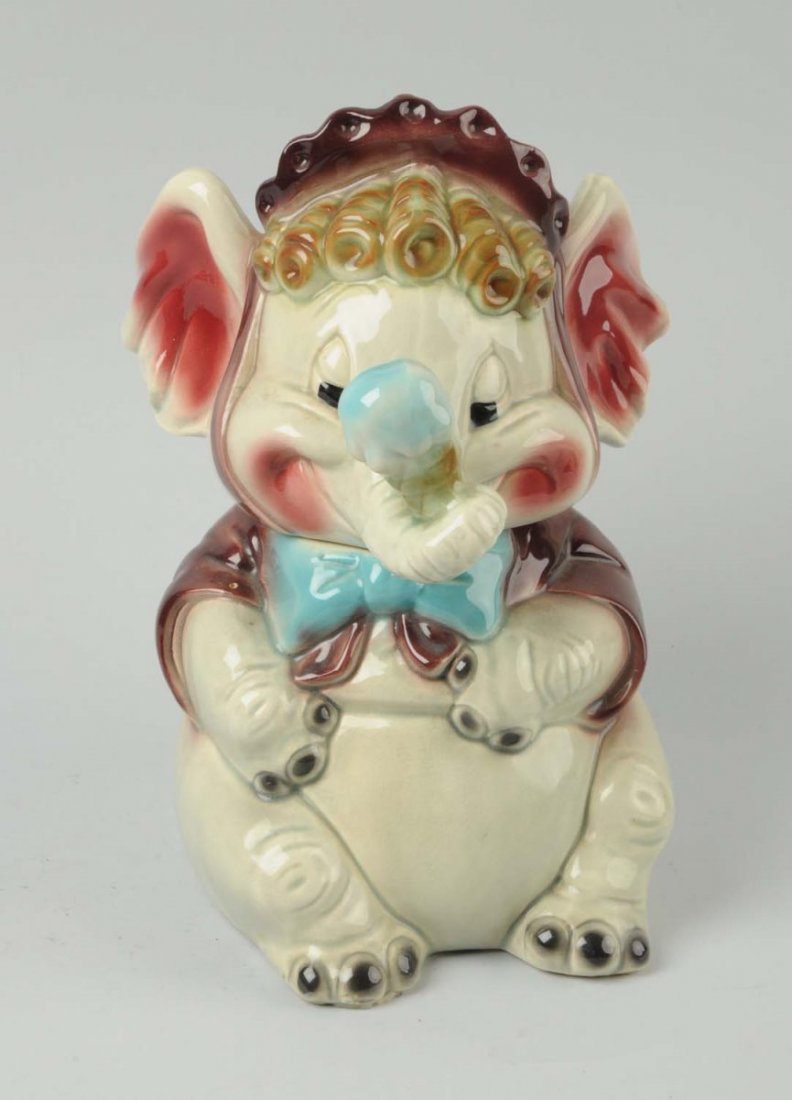 Brush Elephant with Ice Cream Cone Cookie Jar.: This elephant with ice cram cone cookie jar has only moderate overall crazing. Marked "W8 USA" on bottom. Hard jar to find in this color. Condition (Excellent Plus). Size 12'' T.
