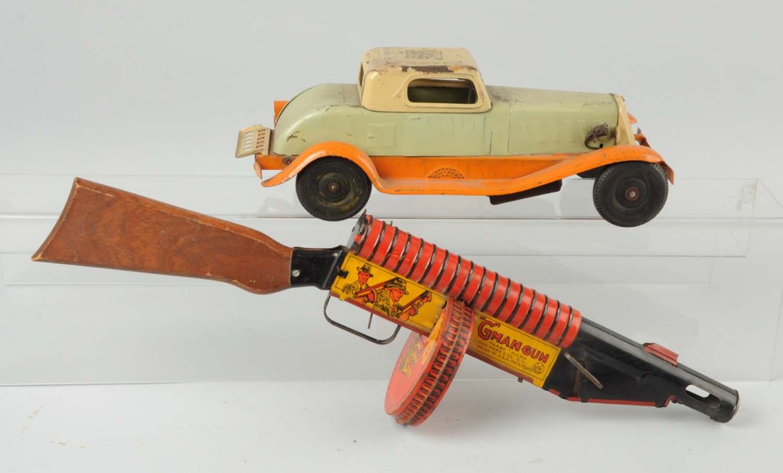 Lot Of 2: Marx Toys.: Lot includes a Marx G-Man gun and a Marx Wind Up Car. Minor to moderate wear. Condition (Very Good ). Size Largest: 23" L.