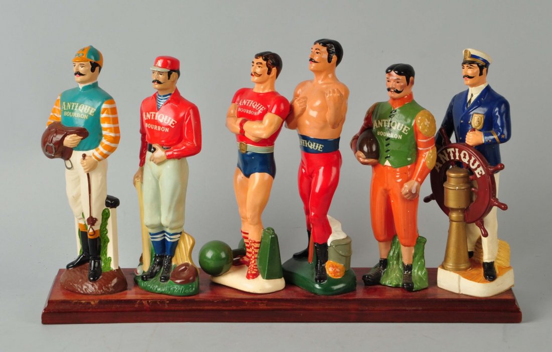 Lot of 6: "Antique Bourbon" Advertising Figures. (1 of 1)