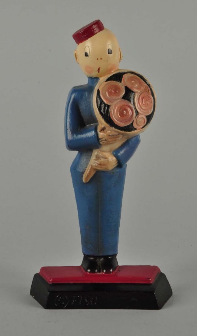 Cast Iron Messenger Boy Doorstop.: Deco designed Bellmen in uniform holding a large bouquet of flowers. Made by Hubley and marked, "Fish, 249". Anne Fish designer. Popular adn desirable. Excellent repaint. Condition (Excellent). Size 9