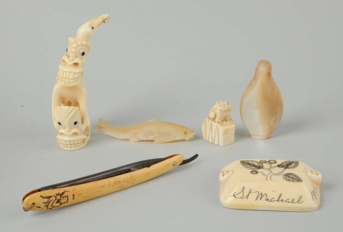 Lot Of 6: Scrimshaw and Netsuke Pieces.: The first is an African looking man with a bird hat is holding a mask. Lower beak of the bird is tipped in gold, 4”tall. The second is a frog sitting on a bucket, signed Yoku Yuki, 1-1/2” tall. Th