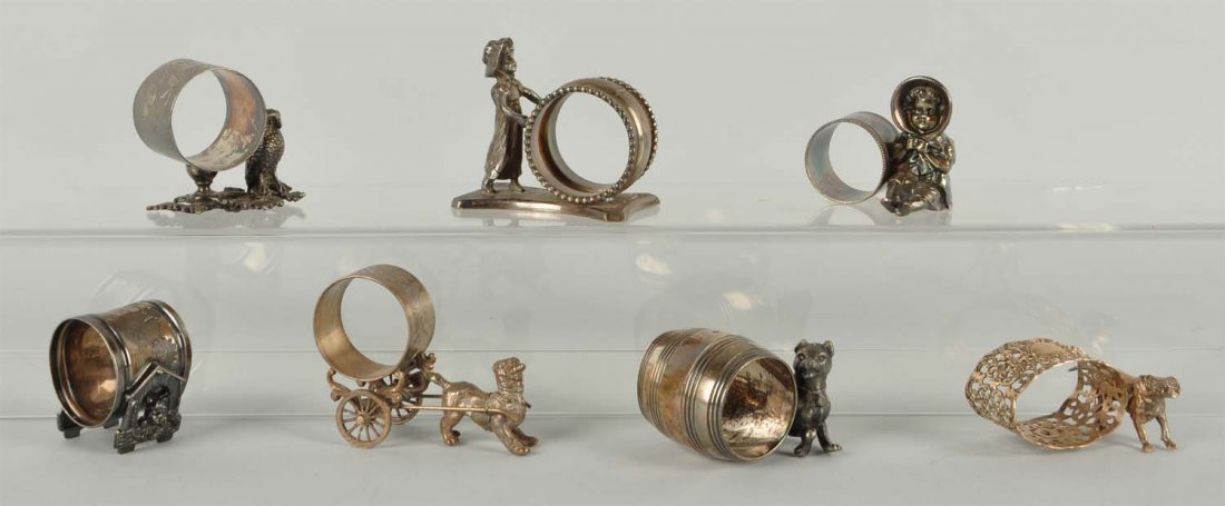 Lot Of 7: Figural Napkin Rings. (1 of 1)