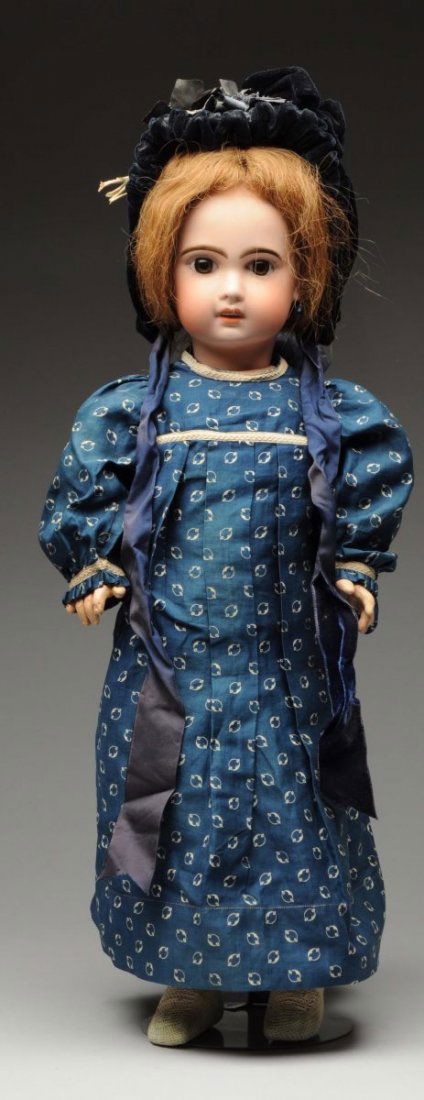 Pretty Jumeau Bébé Doll.: French bisque socket head incised “10” (some speckling on face) with dark multistroked eyebrows, dark paperweight eyes with threaded irises, painted upper and lower lashes, open mouth with upper t