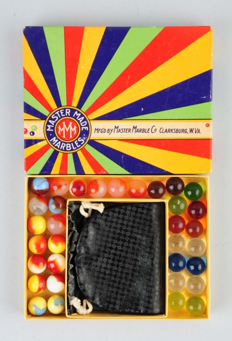 Master Made Marble Box Set.: Box contains 33 marbles which are master patched and clear marbles. Marble bag with insert included. Box near mint. Condition (9.5). Size 5/8" - 21/32" Dia.