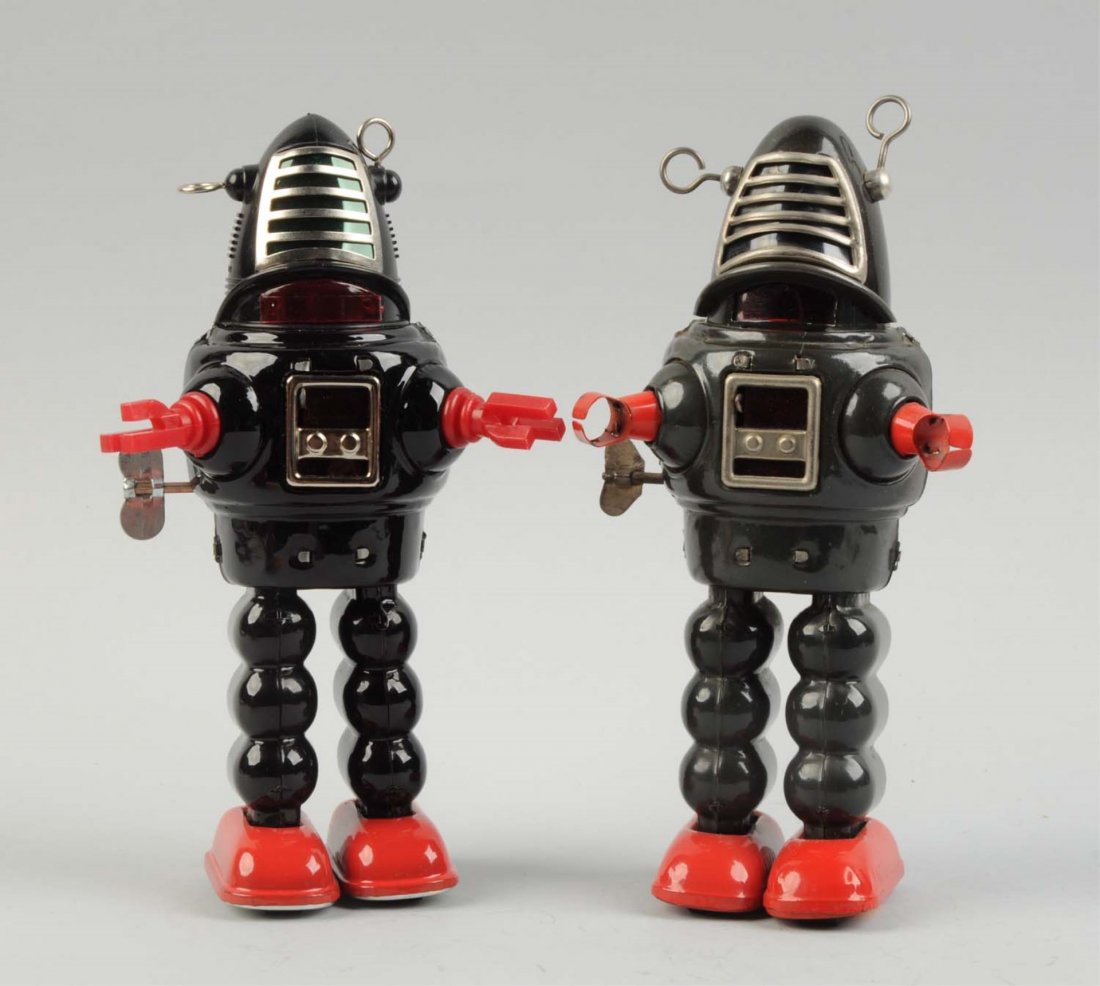 Lot Of 2: Japanese Tin and Plastic Plant Robots.: One early all tin litho version with tin hands. The other tin and plastic version with plastic hands. Much scarcer grey coloring on the early version. Some minor oxidation to bear metal parts and some