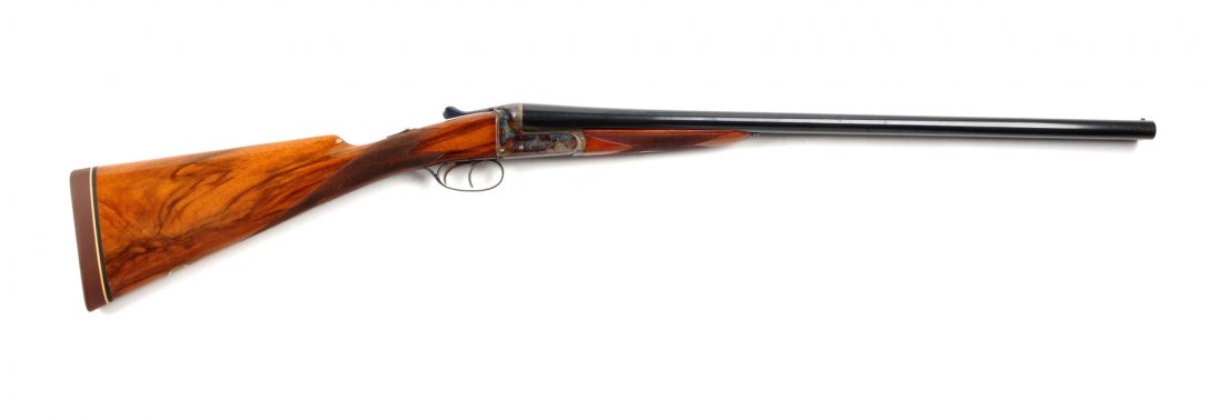 B. Jenkinson SxS 12 Bore Shotgun (C).: Serial # 779 Barrel length 26", 12 bore. This shotgun was manufactured in Birmingham, England by G & S Halloway Ltd., 2-3/4" chamber, blued barrel, solid rib, single bead, mint bores, left bore is "mo