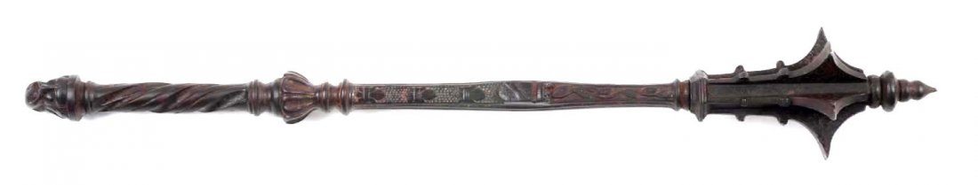 Early English Style Cast Iron Mace.: This solid cast iron mace with heraldic crest and carved head pommel measures 23" and was probably manufactured in England in the 19th century. Extremely heavy, well-made finely finished. Replicates a