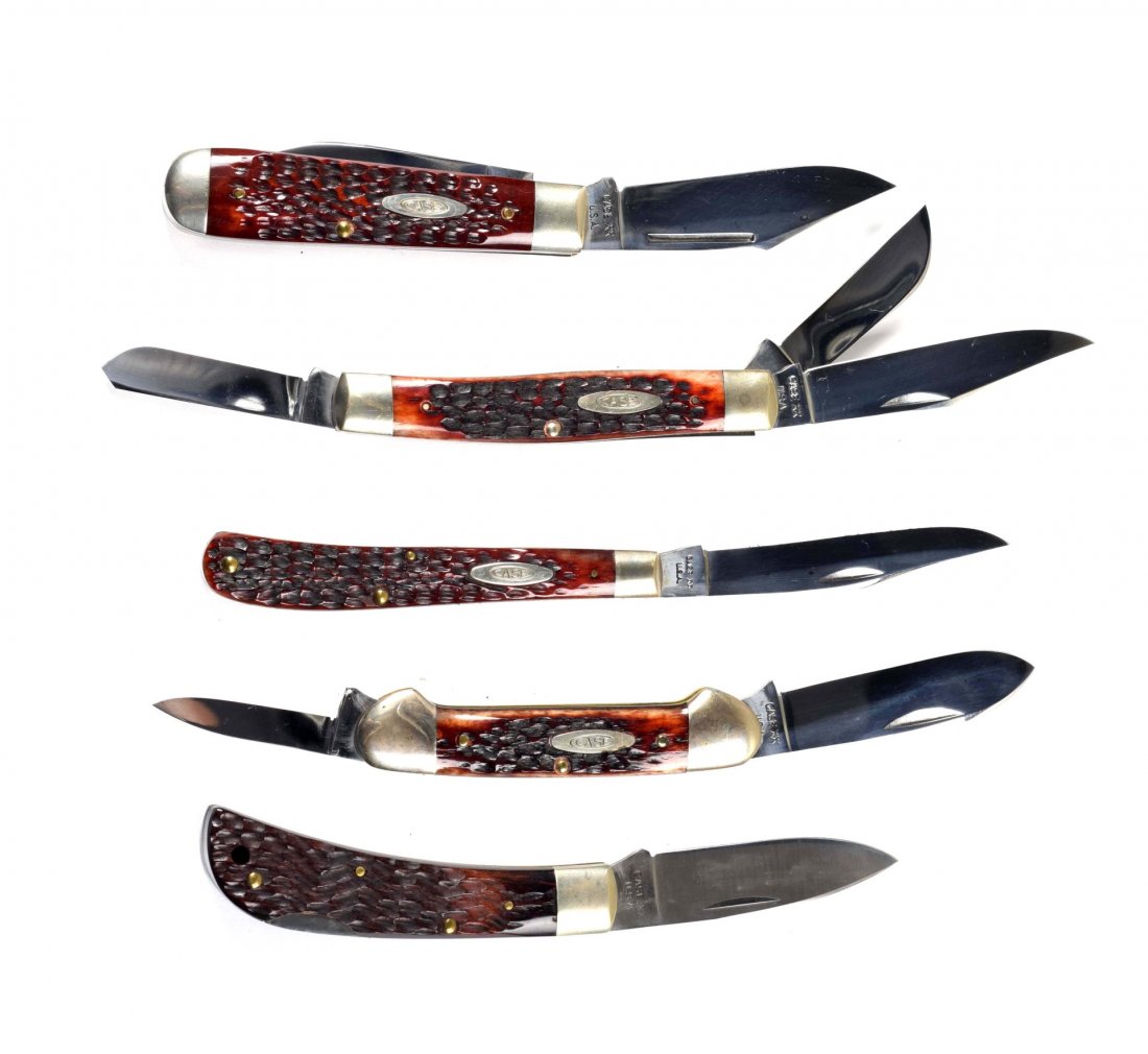 Lot of 5: Case Folding Knives.: Case XX U.S.A. 4-1/8" No. 61048 one-blade slim trapper handled in bone, circa 1964 to 1970. Case XX Stainless U.S.A. 4-1/8" No. 6254 SSP two-blade trapper etched "TESTED XX RAZOR EDGE" and handled in