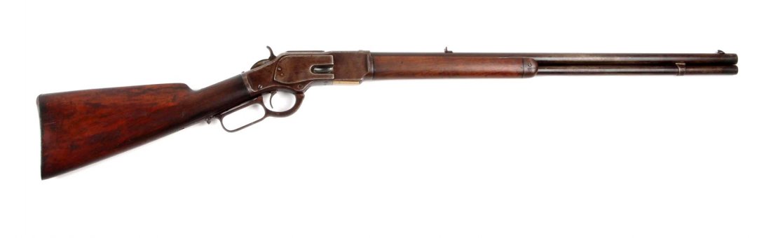 Winchester Model 1873 Lever Action Rifle (A).: Serial # NSV Barrel length 24", .38-40 caliber. Standard Winchester Model 1873 lever action rifle with 24" barrel, full magazine, blue finish, walnut stock, with special order smooth steel shotgun but
