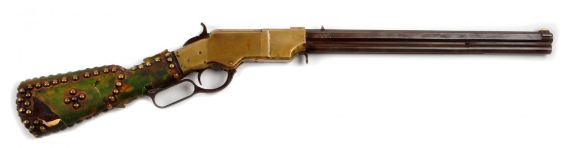 Indian Style Altered Henry Rifle (A).: Serial # NSN Barrel tube is brown, Winchester Markings are gone. "J. Henry" stamped on top. Barrel cut to 16-1/4", rear stock cut. Covered in old material and brass tacks. Works. Decent rifling. .44 r