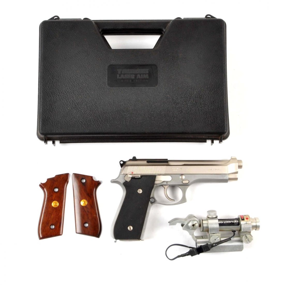 Boxed Taurus Model 92 Semi-Automatic Pistol (M).: Serial # TJC22873 Caliber is 9 mm, 5" barrel. This model sports the satin nickel finish which was discontinued in 1994 and comes with the laser aim sight which was discontinued in 1991. Has the black 