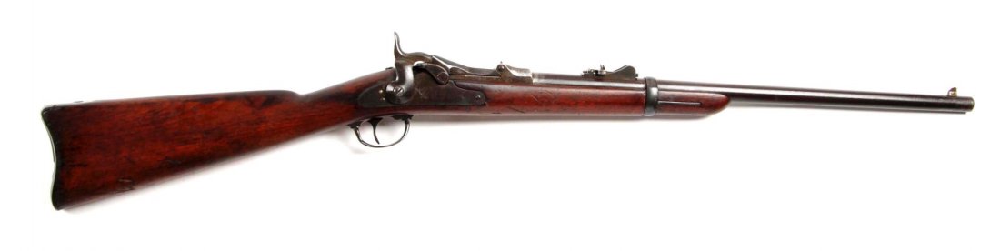 US Springfield Model 1873 Trapdoor S.R.C. (A).: Serial # 75638 Barrel length 22", .45-70 caliber. The serial range places it just after the Custer Massacre and is a standard issue Trapdoor carbine in all respect. All metal finish is a brown patina.
