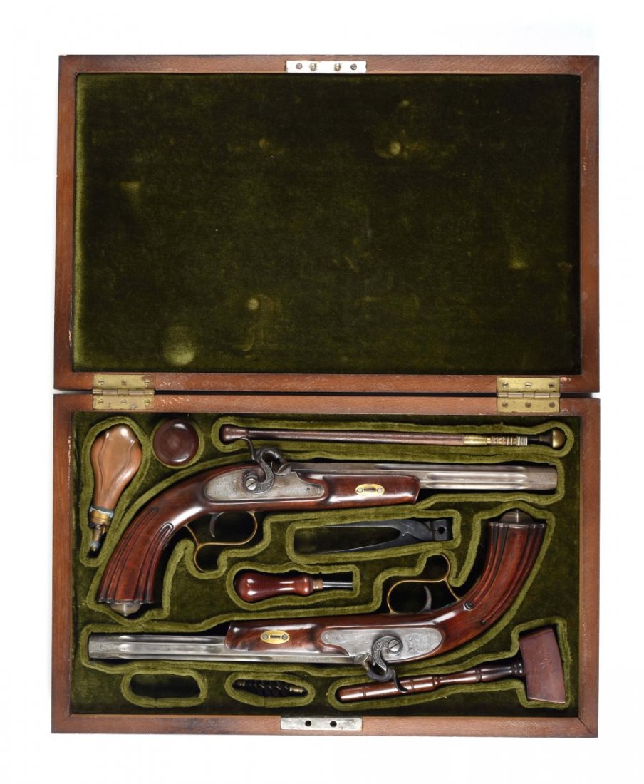 Cased Set of French Dueling Pistols (A).: Pair of matching percussion pistols with case lined in green velvet with accessories. Barrel marked "P. BRILLE A PARIS". Comes with flask, two lead rounds in a wood container, bullet mold, cleaning to