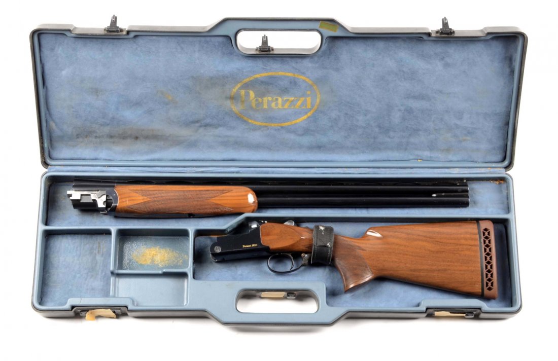 Perazzi MX3 O/ .20 Bore Shotgun (M).: Serial # 61619 20 Bore, Brescia, Italy, has 3" chamber, barrels measure 26", features full vent rib, single bead front sight, blue finish, checkered walnut stock, red rubber waffle recoil pad, has sin