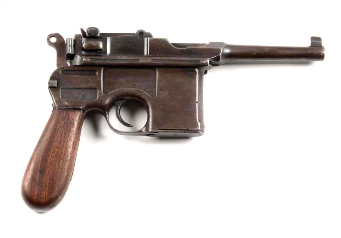 German Mauser Broomhandle (Bolo) Pistol (C).: Serial # 692609 4" barrel in 7.63mm caliber. All metal parts on this Bolo are a grey-brown patina with flashes of blue. Some areas of light pitting. Walnut grips are homemade replacements and are ceme