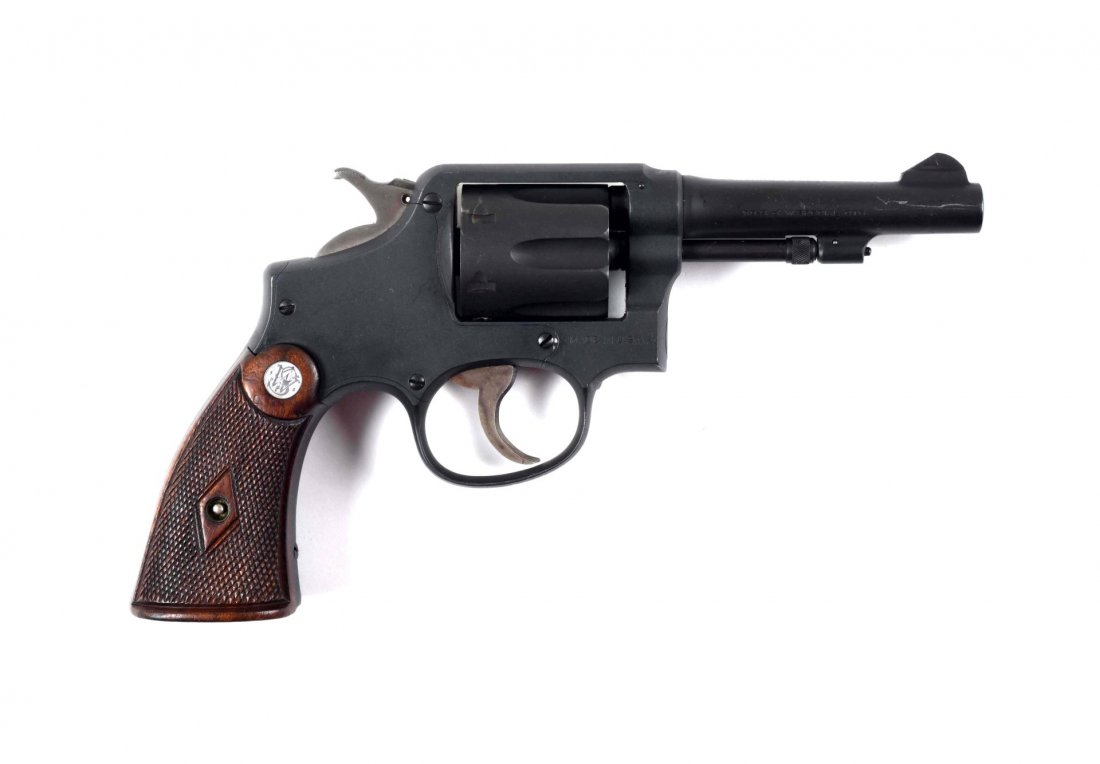 S&W M&P Double Action Revolver (C).: Serial # 650367 4" barrel chambered for the .38 Smith & Wesson cartridge. This is a 'K' frame manufactured from 1915 to 1942. Six shot and double action. Hammer is polished and the trigger is case col