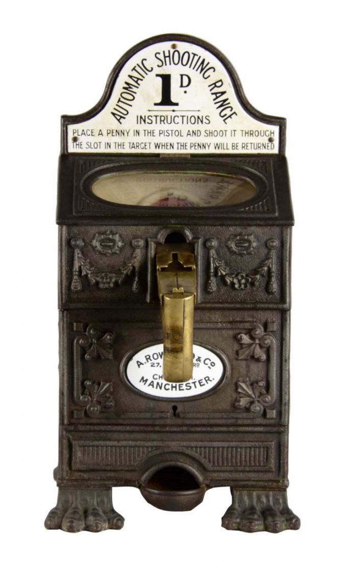 English A. Rowland & Co. Automatic Shooting Range: This countertop game operates on an old English penny. Cast iron case features porcelain plaques and front gun handle. By A. Rowland & Co. Manchester, serial number 442. In original condition with the