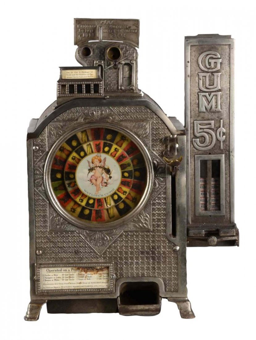 **5¢ Watling Cupid Counter Wheel Trade Stimulator: This rare machine with side mint vendor has two coin slots, one for Canadian and one for American coins. Shows slight patina throughout with a small chip to edge of the rear door. Rear door of the ven
