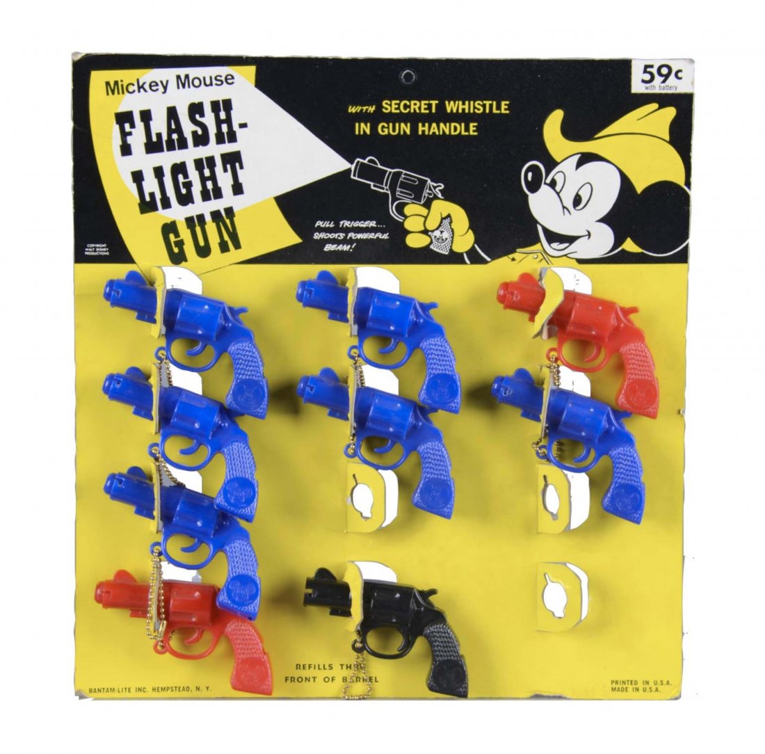 Mickey Mouse Flashlight Gun Display: This cardboard display features Mickey Mouse in a cowboy hat and holding a flashlight revolver. The display still contains 9 of 12 flashlights. There is some very light damage on the edges of the card