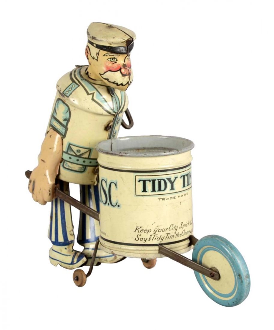 Marx Mechanical Tin Lithograph Tidy Tim Toy: This wind up tin toy of Tidy Tim the street sweeper was manufactured by Louis Marx & Co. "Keep your city spick and span says Tidy Tim the clean-up man." Lithograph has some scratches. Condition (Very