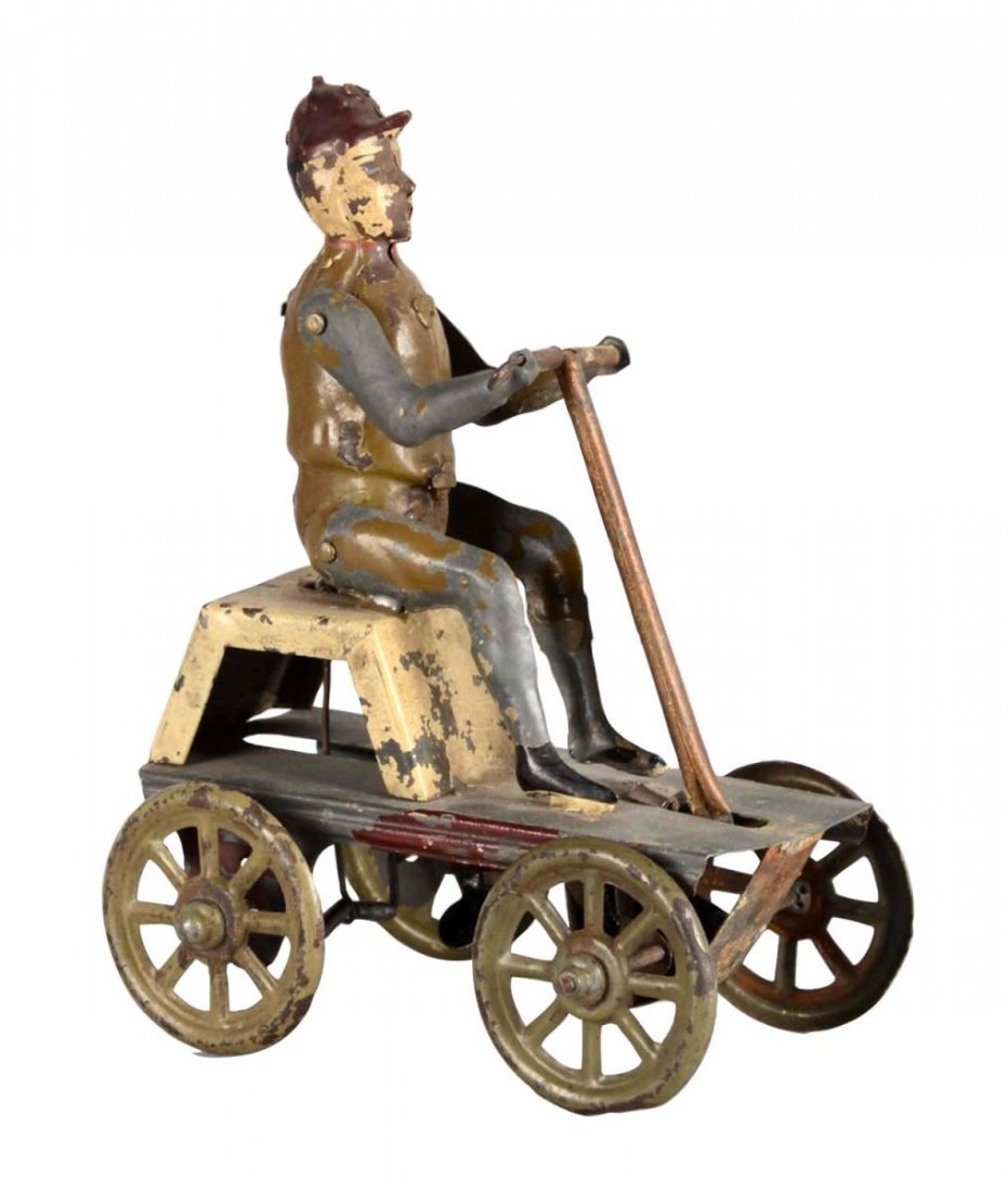 Man On Hand Car Mechanical Tin Toy: This is a wind up tin toy of a man operating a handcart. Toy has worn with surface dirt and chipped paint. It is operational. Condition (Fair). Size 5" L.