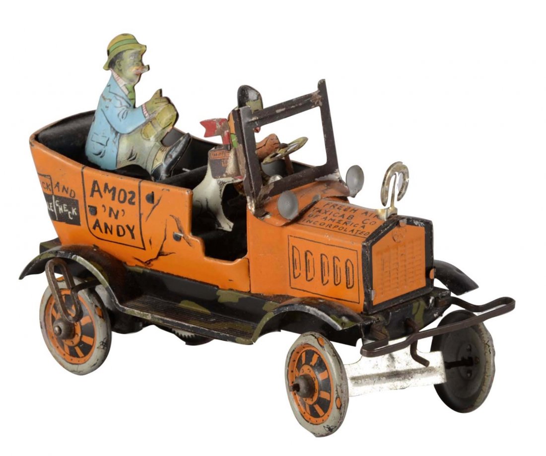 Marx Amos And Andy Mechanical Tin Toy: This tin wind up toy of Amos and Andy's Fresh Air Taxi was manufactured by Louis Marx and Co. Toy has some surface dirt and worn spots. Condition (Very Good). Size 8" L.