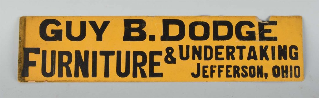 Guy B Dodge Furniture & Undertaking Sign.: Made of cardboard. Sign has areas of paper loss and cracking with some soiling to the left edge. Condition (Fair). Size 24" x 5 -1/2".