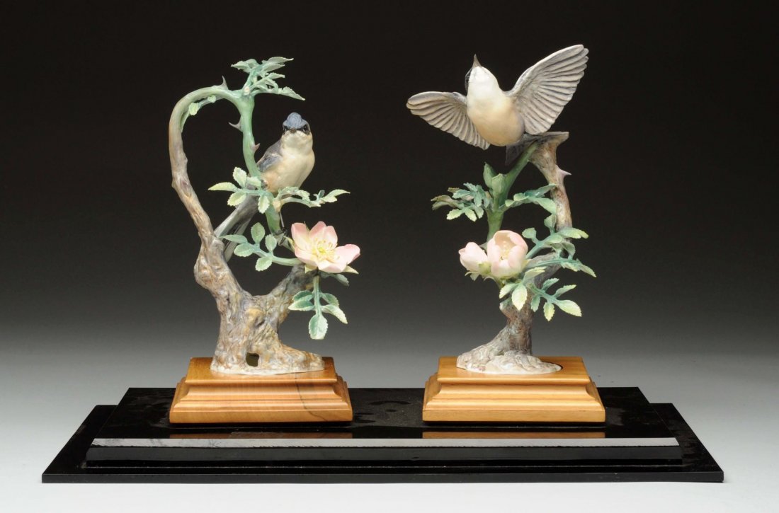 Pair Of Doughy Worcester Porcelain Birds.: Birds are in thorn bushes. One with broken tip off leaves and broken twig. Both sit on wooden plaques on Lucite stand. Size 17 -3/4" x 12".