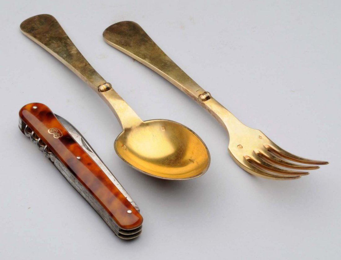 Mini Foldable Silverware Set in Leather Case.: Includes spoon, fork and knife with corkscrew. Knife has a portion of celluloid missing at the bottom. Size 4 - 1/2" T.