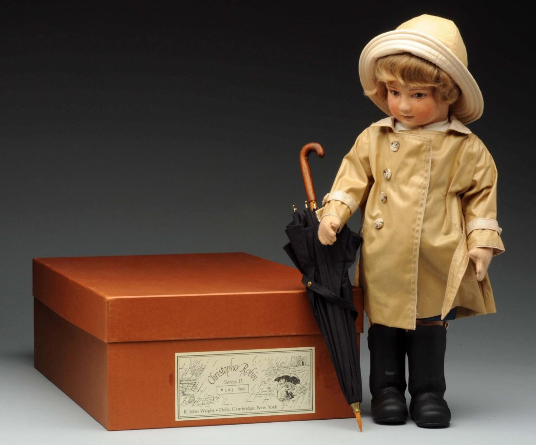 R. John Wright "Christopher Robin Series II".: Who says a rainy day can't be fun? Not Christopher Robin, for sure! This adorable edition is 18" tall, fully jointed, and made from molded felt. He's dressed for a deluge in a perfectly proportioned r