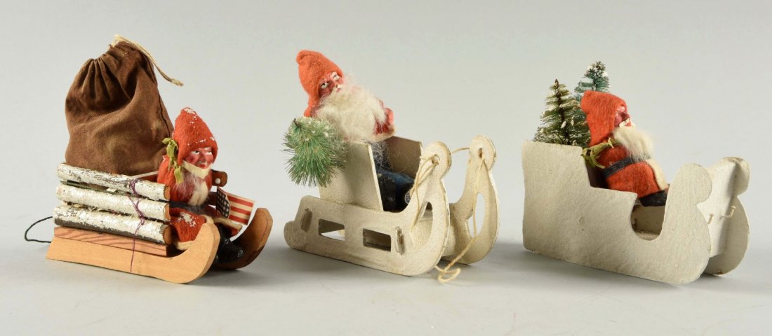 Lot Of 3: Small Early German Santas on Sleighs. (1 of 2)