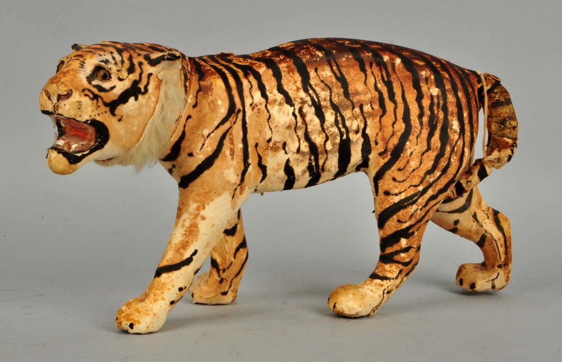 Early Papier Mache Tiger Candy Container.: Unmarked but probably German. Made of composition. Candy goes inside body as head comes off. Missing two teeth on left hand side. Glass eyes. Needs some repair to tail. Other chipping throughout. Cond