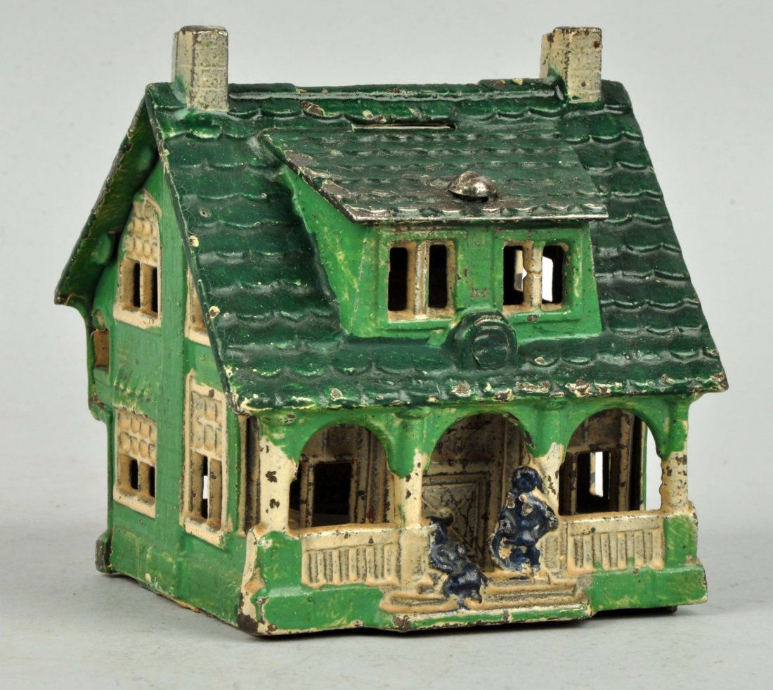 Cottage Cast Iron Still Bank. (1 of 2)