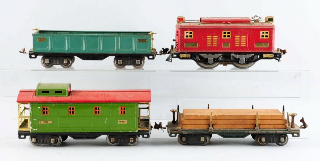 Lot Of 4: Lionel No. 8 Locomotive & Freight Cars.: No. 8 Electric Outline Locomotive, red, missing one piece of whistle trim otherwise is complete and all original. No. 512 Gondola, complete and all original. No. 511 Flat Car with lumber load,complete