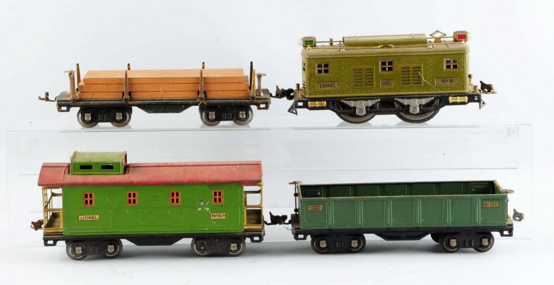 Lot Of 4: Lionel No. 8 Locomotive & Freight Cars.: No. 8 Electric Outline Locomotive, olive green, hand reverse, complete and all original. No. 512 Gondola, complete and all original significant rust issues on the frame. No. 511 Flat Car with lumber l