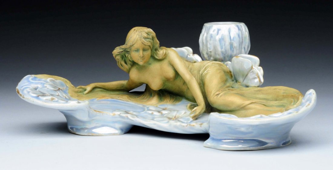 Ernst Wahliss Co. Ceramic Reclining Maiden.: Candlestick Tray, 5 inches high, 1900. Ernst Wahliss Mark, Made in Austria, impressed 4662, Mint. Illustrated in Monsters and Maidens Collectors Edition,Byron Vreeland, page 459.