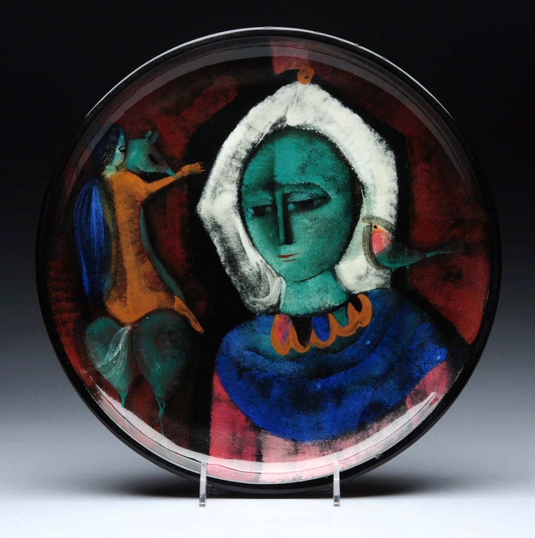 Pillin Serving Tray/Plate.: Shallow tray is decorated with a white haired woman with a bird on her shoulder and a young woman riding away on a horse. One very minor rough spot on the inside rim. Condition (Very Good). Size 13'' 
