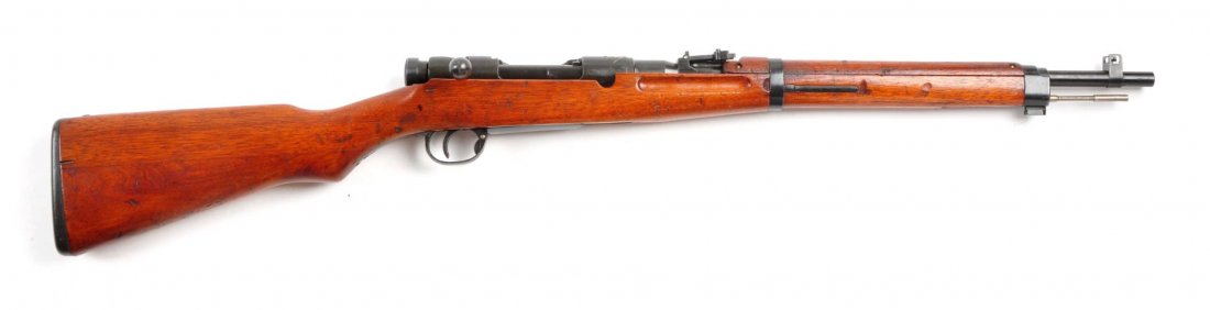 (C) Japanese Type 38 Carbine.: Serial # 49037 19" barrel in caliber 6.5mm Japanese. Manufactured at the Nagoya Arsenal. Has the inverted V front sight with guards, unfinished cleaning rod, open V rear sight to 2,000 meters, ground 