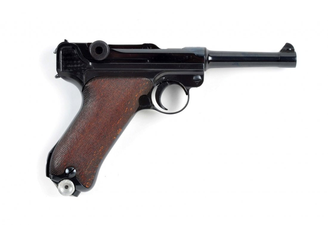 (C) German Luger Double Date DWM.: Serial # 5861 4” barrel in 9mm caliber. This pistol was manufactured in 1917. It has the 1920 date added to bridge. These are referred to as double date models and were re-worked and re-issued to Ge