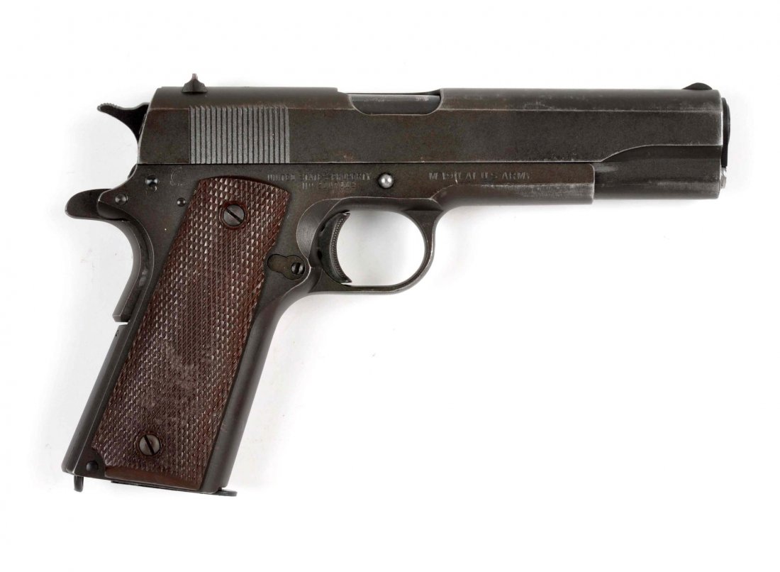 (C) Ithaca 1911 A1 U.S. Army Pistol.: Serial # 2107012 Caliber .45 ACP, Barrel length 5”. Manufactured in 1944. Standard Ithaca manufacture Model 1911 left side of slide is stamped “Ithaca Gun Co Inc Ithaca NY” Right side of slide i