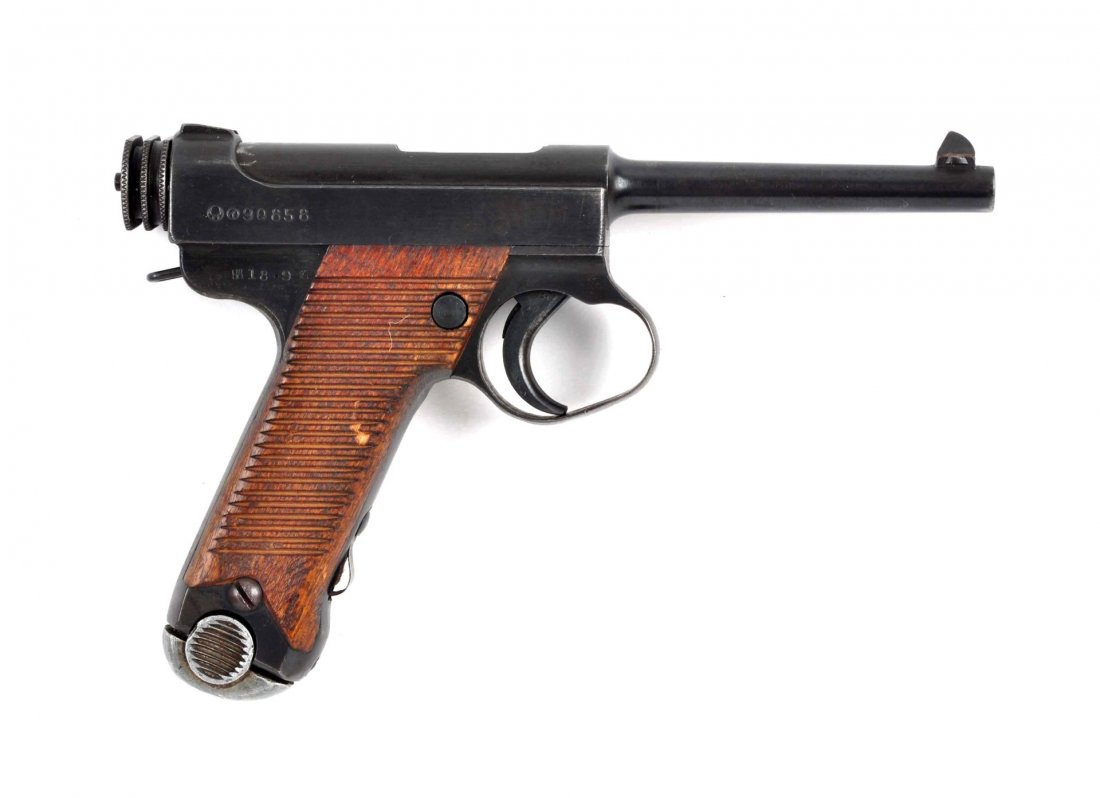 (C) Japanese Type 14 Nambu Semi Automatic Pistol.: Serial # 90858 Caliber 8 mm Nambu, Barrel length 4-3/4”. Manufactured at the Toriimatsu factory of Nagoya Arsenal, Jan 1942-Nov 1943. Has the twenty four serration mahogany grips. Frame markings sig