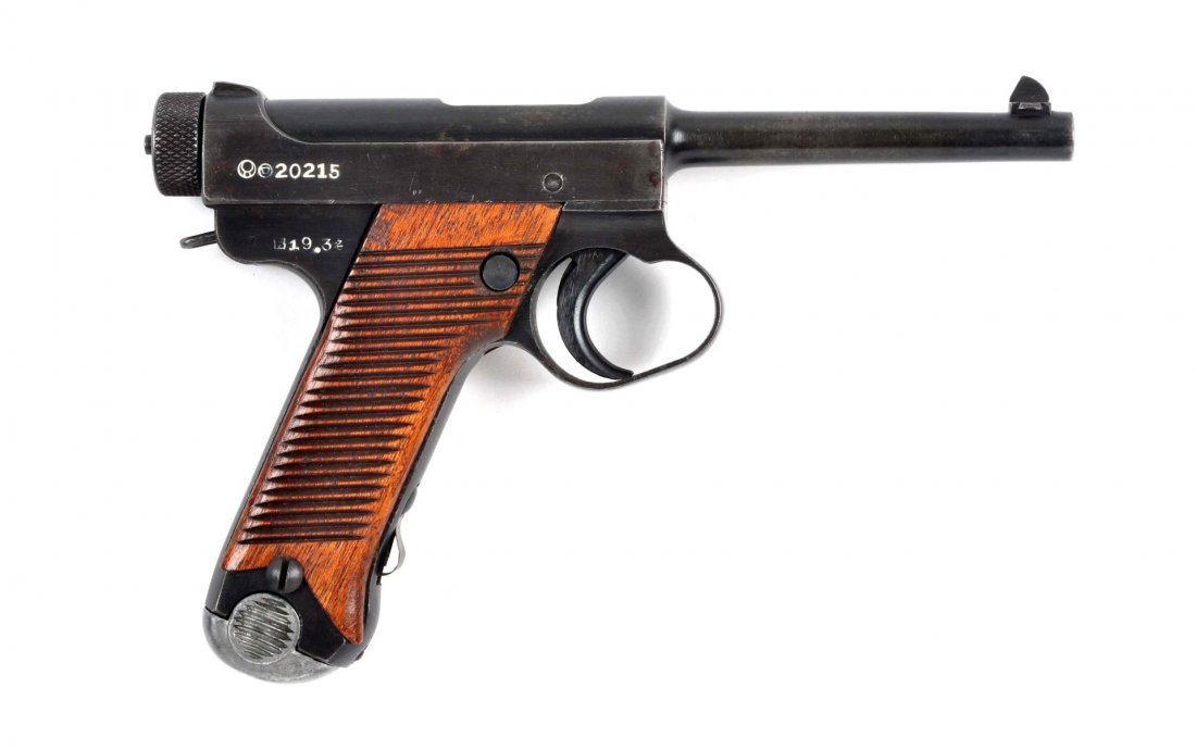 (C) Japanese Type 14 Nambu Semi Automatic Pistol.: Serial # 20215 Caliber 8 mm Nambu, Barrel length 4-3/4”. Manufactured at the Toriimatsu factory of Nagoya arsenal, March 1944-Aug 1945. Has the twenty four serration mahogany grips. Frame markings s