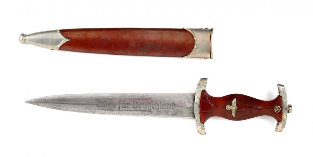Nazi Dagger.: SA (Storm Trooper) dagger. Overall length is 13-3/4", blade is 8-3/4". Front blade face is etched "Alles für Deutschland" (All for Germany). Hardwood handle is cracked full length of handle. Correct 