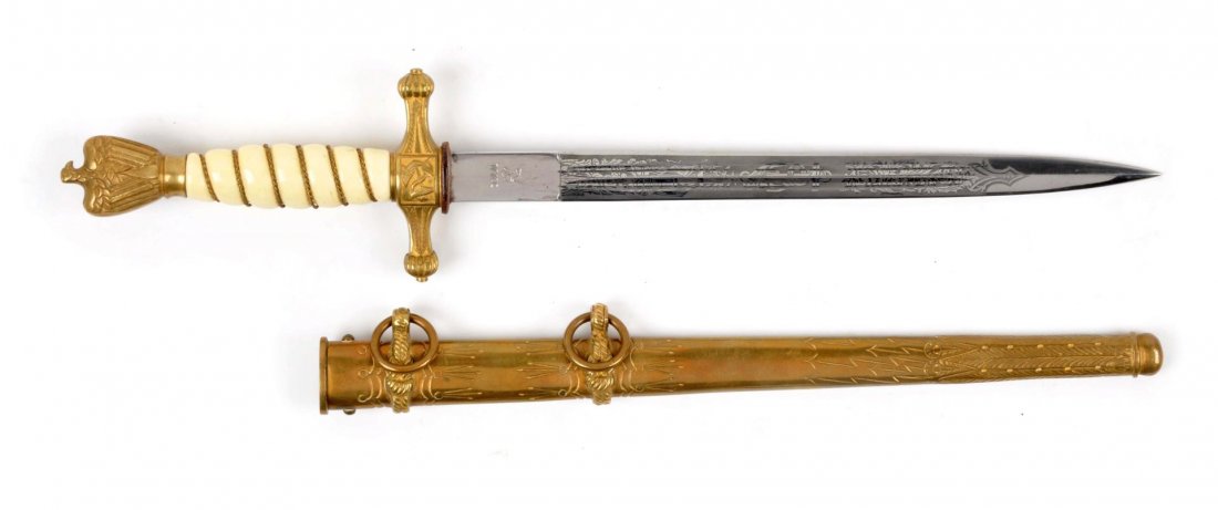 Nazi Kriegsmarine Dress Dagger.: Dagger has double fullers, spear point, etched blade, "WKC" marked. Blade measures 9-3/4". Has the gold plated handguard and pommel. Pommel has eagle with swastika. White broke grip with brass braid. 