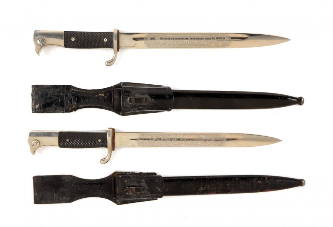 Lot of 2: Nazi German Dress Bayonets.: Both have the same etched slogan "In memory of my service time" but both have different imagery of weapons. One is an anti-aircraft while the other is a machine gun. Both knives have the back composit