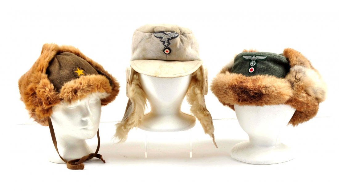 Lot of 3: Japanese & German Winter Soft Hats.: The Japanese hat is a green wool with a sewn yellow star, fur lined, with Japanese writing on the inside lining, and a chinstrap. German white leather with leather bill, fur lined, has the eagle with 