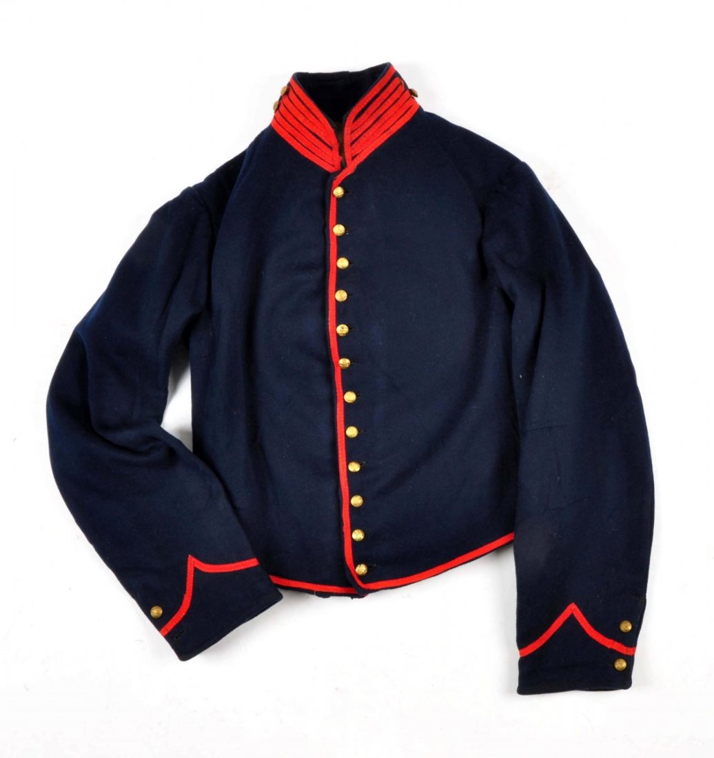 U.S. Civil War Artillery Shell Jacket.: This jacket is in excellent condition, made of blue wool with red piping with all but three of its original buttons (missing one collar button and one from each cuff). There is a two inch area of seam
