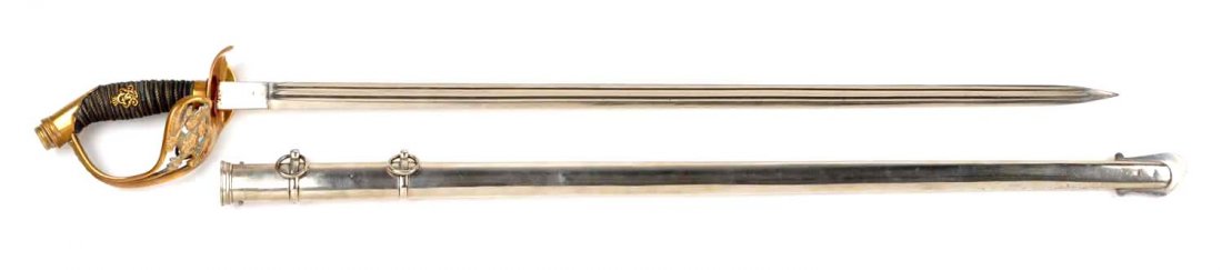 W.K. & C. Prussian Dress Sword with Sheath.: Blade is make stamped, double fuller, and measures 31". Sharkskin handle with brass royal crest, brass pommel, brass handguard with royal crest, wire wrapped. Blade is near mint. Scabbard is nickel pl