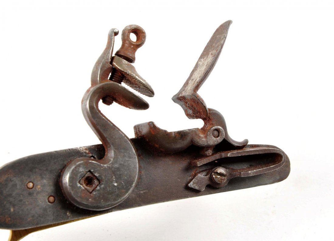 Lot of 7 Misc. Musket Parts.: To include: an old brass tip rifle musket rod with the jag end measures to cupped tulip head- 44”. There is a cast iron musket butt plate, an iron ornate trigger guard with engraving measuring 10”